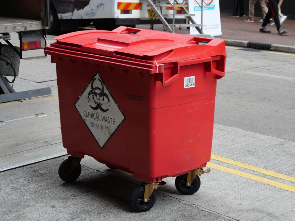 A red bin for hazardous waste collection